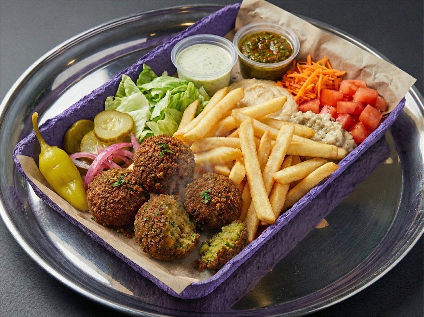 Falafel, salad, and Mediterranean sides