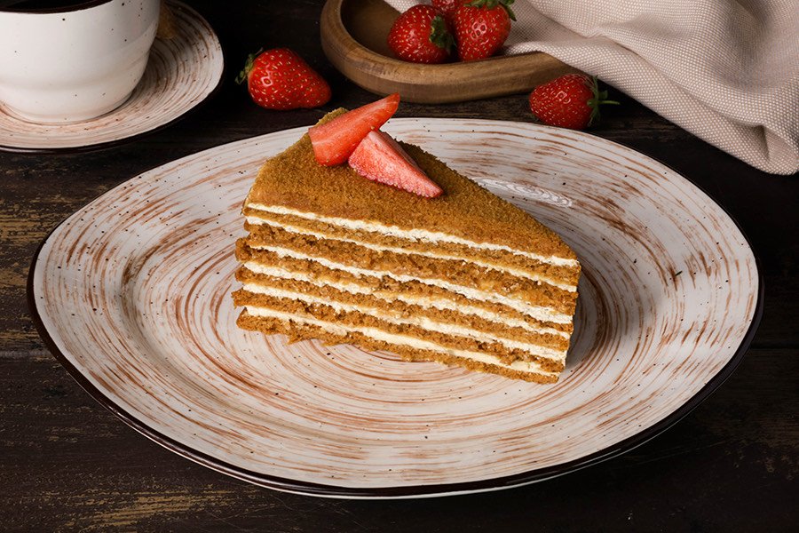 Layered honey cake with strawberries