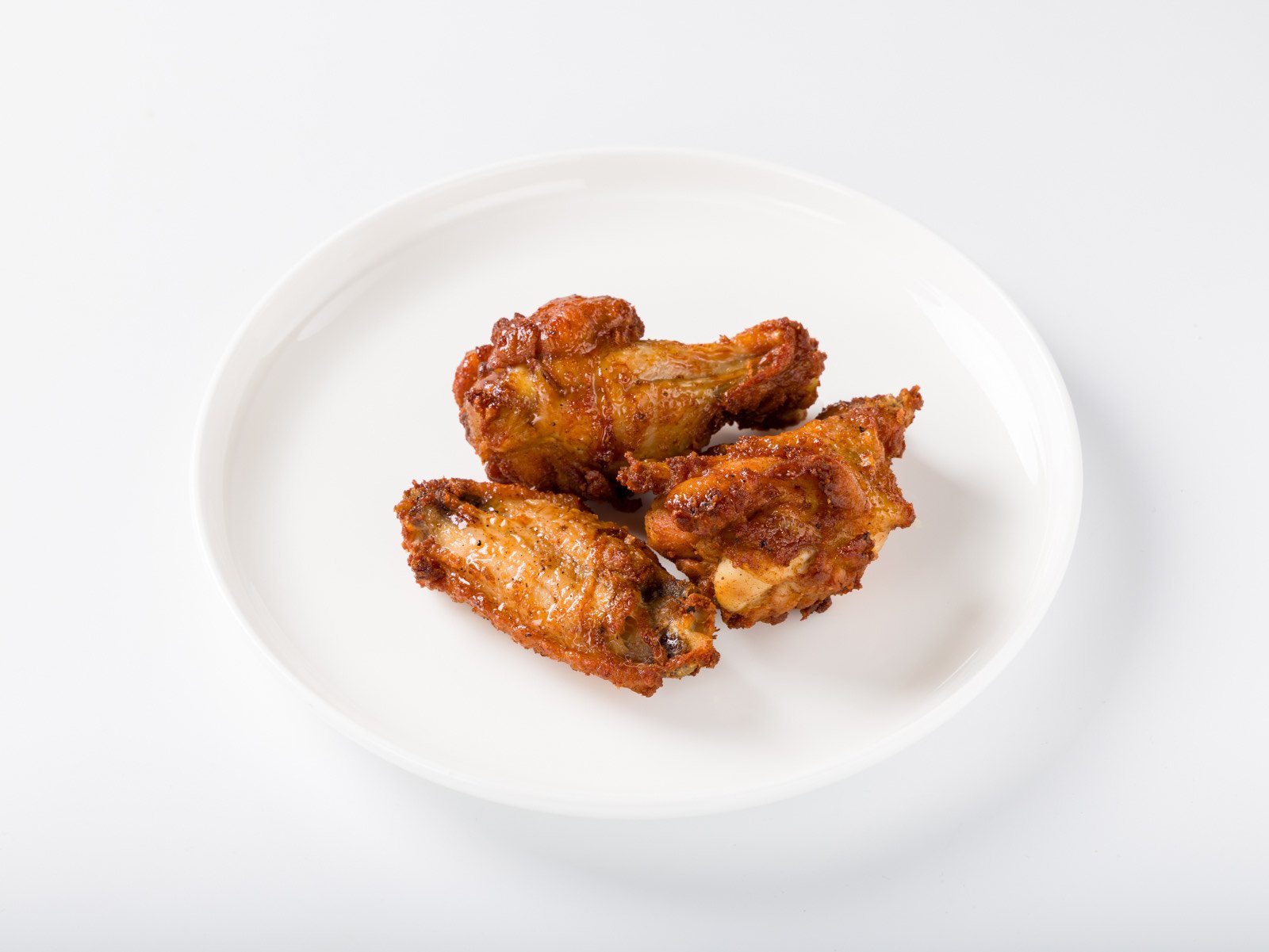 Crispy fried chicken wings with buffalo sauce